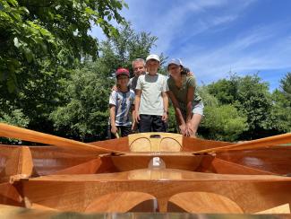 Family photo with our newly built Eastport Pram